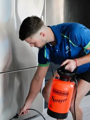 Green Clean technician in branded uniform inspecting a Hong Kong property